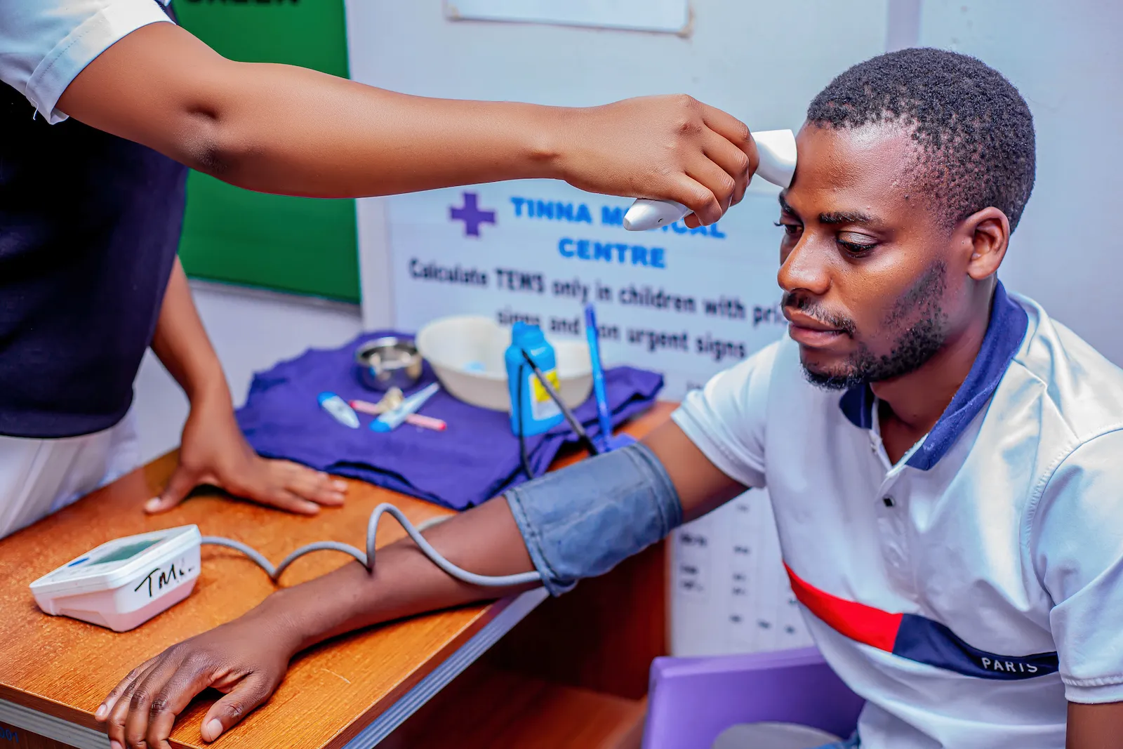 Nurse checking a patient's vital signs